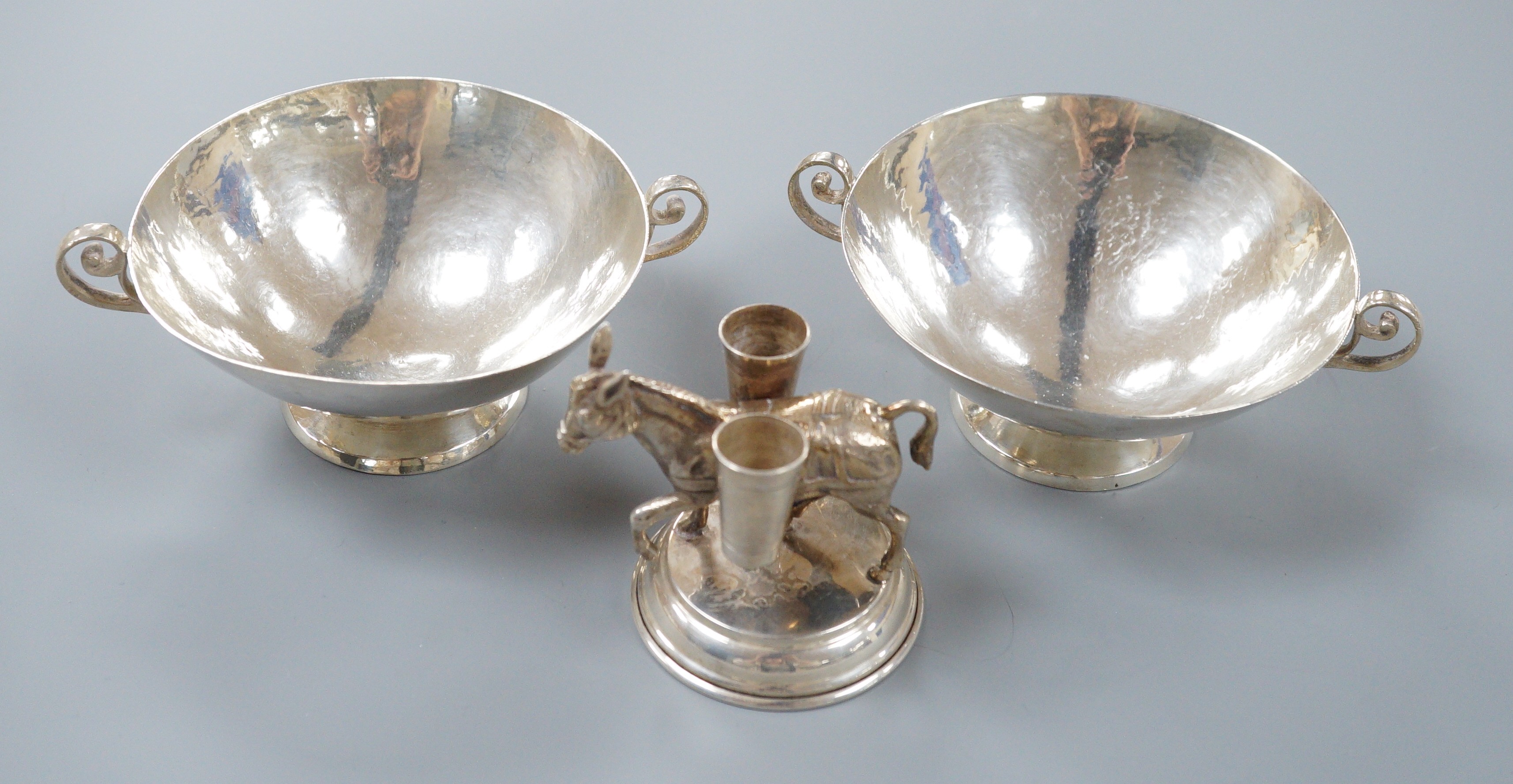 Two Chilean Hecho Amano 900 standard white metal two handle finger bowls, diameter 13.5cm and a Spanish white metal donkey vesta vase, 68mm.